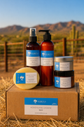 Sybena skincare products on a hay bale with a scenic background